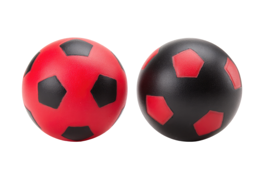 Two soccer balls, red and black, isolated on black