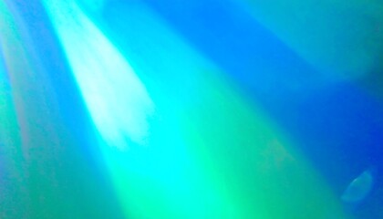 Abstract light streaks in vibrant blues and greens