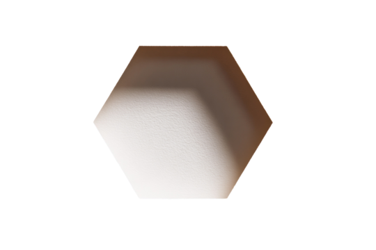 Close-up of a light beige, hexagonal, geometric shape.  Soft light highlights one edge