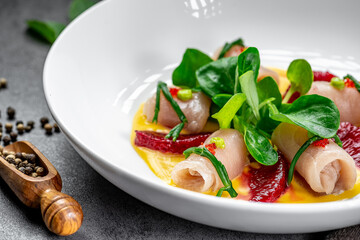 Elegant dish with gourmet presentation. Fresh ingredients are artfully arranged on a plate, showcasing culinary creativity and vibrant colors.