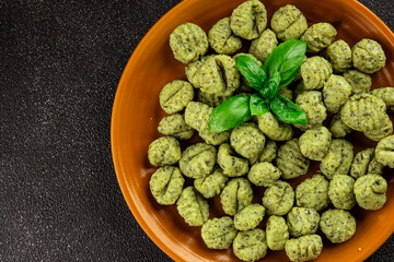 Gnocchi spinach potato dough second course portion size natural product tasty snack fresh delicious gourmet food background on the table rustic top view copy space