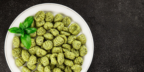 Gnocchi spinach potato dough second course portion size natural product tasty snack fresh delicious gourmet food background on the table rustic top view copy space