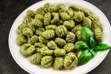 Gnocchi spinach potato dough second course portion size natural product tasty snack fresh delicious gourmet food background on the table rustic top view copy space