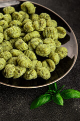Gnocchi spinach potato dough second course portion size natural product tasty snack fresh delicious gourmet food background on the table rustic top view copy space