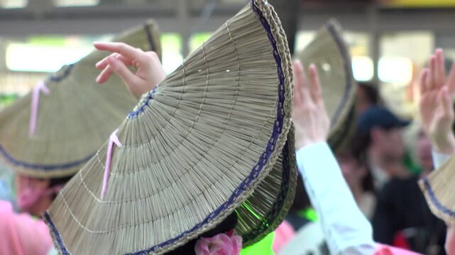 TOKYO, JAPAN - AUG 2025 : Slow motion shot of Awa Odori dance festival in Koenji. Powerful and energetic dance and music. Traditional Japanese summer event in Tokyo. Close up shot of dancer.