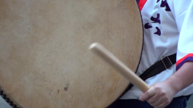 TOKYO, JAPAN - AUG 2025 : Slow motion shot of Awa Odori dance festival in Koenji. Powerful and energetic dance and music. Traditional Japanese summer event in Tokyo. Close up shot of drum.