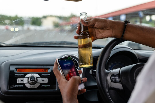 Drinking and driving distraction in a car interior - Powered by Adobe