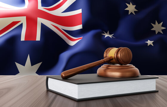 Judge gavel on the desk on background of Australia flag. Law and justice concept