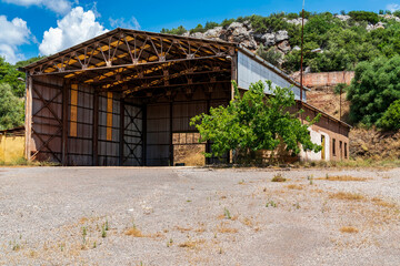 Abandoned industrial warehouse at Larko Mining site
