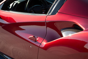 Fototapeta premium Partial side view of air intake in red sports car