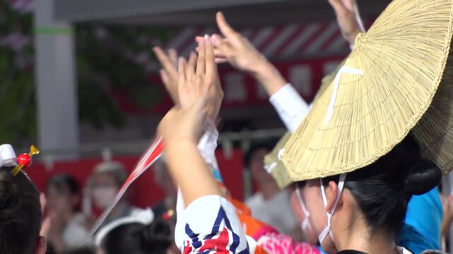 TOKYO, JAPAN - AUG 2025 : Awa Odori dance festival in Koenji. Powerful and energetic dance and music. Traditional Japanese summer event in Tokyo. Slow motion shot of dancer.