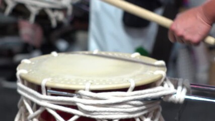 TOKYO, JAPAN - AUG 2025 : Slow motion shot of Awa Odori dance festival in Koenji. Powerful and energetic dance and music. Traditional Japanese summer event in Tokyo. Close up shot of drum.