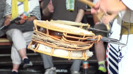 TOKYO, JAPAN - AUG 2025 : Slow motion shot of Awa Odori dance festival in Koenji. Powerful and energetic dance and music. Traditional Japanese summer event in Tokyo. Close up shot of drum.