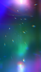 Abstract colorful background with light effects, prismatic reflections and bokeh. Vibrant gradient from purple to green with luminous rays and floating particles.