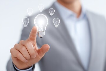 Man is pointing at a light bulb on a computer screen