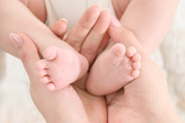 HOUSTON, TEXAS - JANUARY 6th 2024: Newborn portraits in The Woodlands studio with soft lighting, white backdrop, and Christmas lights&mdash;capturing timeless love and tender family moments.