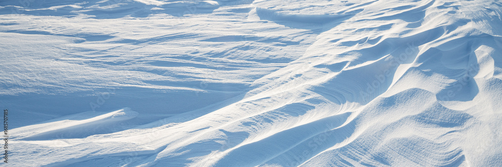 Sticker snow texture. wind sculpted patterns on snow surface. wind in the tundra and in the mountains on the