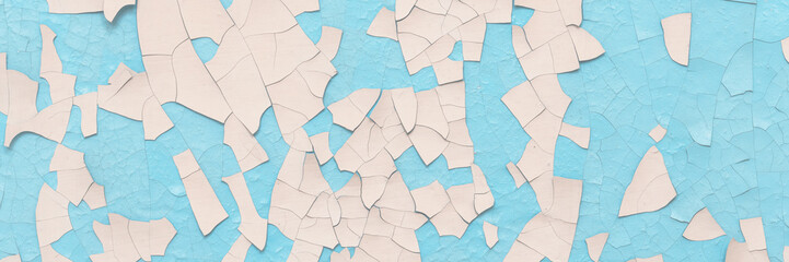 Peeling paint on the wall. Old concrete wall with cracked flaking paint. Weathered rough painted...