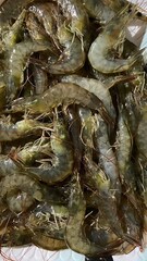 Pile of fresh, raw shrimp, ready to be cooked.