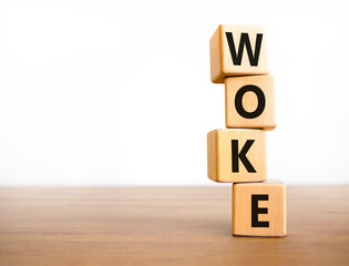 Woke question symbol. Concept word Woke question on beautiful wooden blocks. Beautiful wooden table white background. Business, lifestyle, support and woke question concept. Copy space.