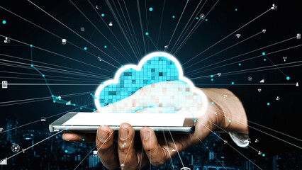 A modern representation of cloud computing, showing a hand holding a smartphone with digital cloud...
