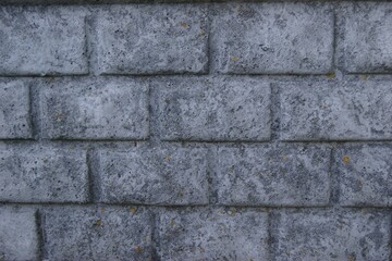 Textured Concrete Wall with Weathered Brick Pattern