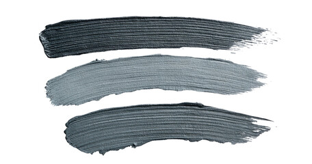 Three horizontal brushstrokes of a dark gray, metallic, paint or cosmetic product