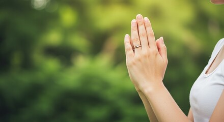 Close of a person praying to God with faith and devotion to Christ, spiritual comfort and gratitude