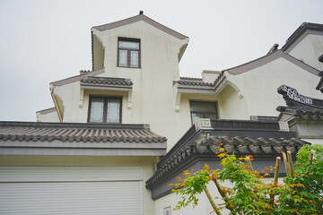 Nantong, Jiangsu, China: 04 21 2025: Beautiful Jiangsu traditional Chinese building, Roof, wall, tile and door