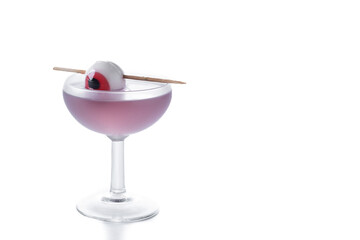 Purple Halloween cocktail garnished with candy eye isolated on white background. Copy space