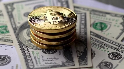 Golden bitcoin cryptocurrency coins stacked on us dollar bills representing digital and traditional currency investment, trading, and financial market dynamics - Powered by Adobe