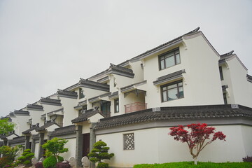 Nantong, Jiangsu, China: 04 21 2025: Beautiful Chinese Jiangsu village building and landscape in spring