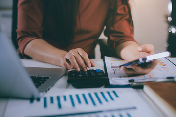 Portrait of young Hispanic professional business woman standing in office. Happy female company executive, smiling businesswoman entrepreneur corporate leader manager looking at camera using tablet