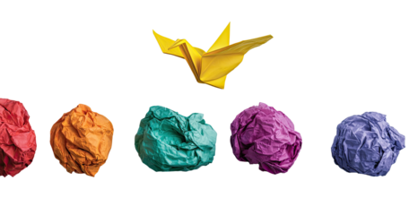 Colorful crumpled paper balls, vibrant yellow origami bird