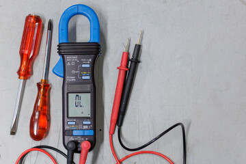 Clamp Meter and Tools on Workbench