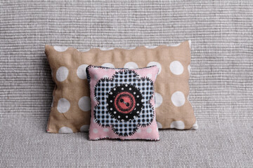 Cushions with spotted pattern