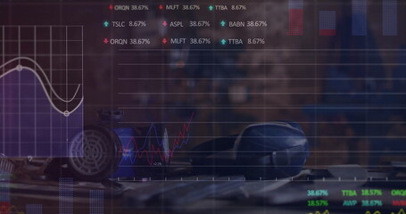 Fototapeta premium Displaying rotary telephone and motorcycle helmet and wrench on wood counter, with charts overlay