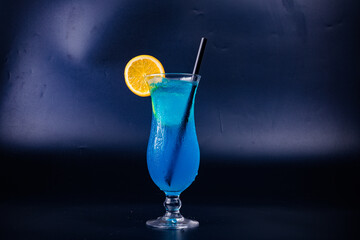 blue cocktail with lime