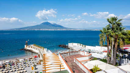 Panoramic view of Castellammare di Stabia beach with azure waters and clear skies on a sunny summer...