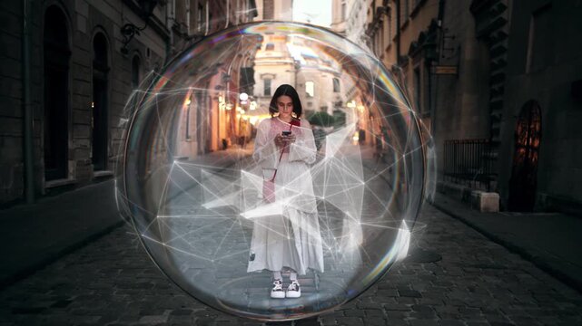 Conceptual video of young woman standing in glowing digital bubble while using smartphone, symbolizing information filter and social media isolation