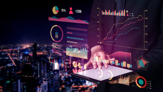 A business professional stands against a glowing urban skyline at night, analyzing data on a tablet. Engaging charts and visuals enhance the scene, highlighting modern data-driven strategies. Impute - Powered by Adobe
