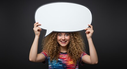 Thought Bubble Expressions: A vibrant woman, smiling, holds up an empty speech bubble, exuding an inviting and positive vibe. This visual is ideal for conveying thoughts, ideas, and communication.