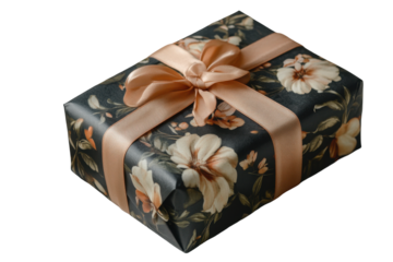 Close up of a beautifully wrapped present with black ribbon and floral patterned paper for christmas, birthday or other holiday