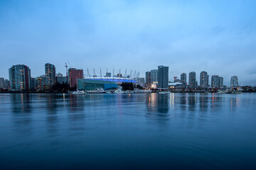Obraz premium Vancouver, Canada - April 09, 2017: The city of Vancouver illuminated at night with the famous BC stadium.
