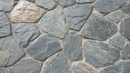 Obraz premium A closeup shot of a stone wall showcasing a beautiful texture, ideal for backgrounds and designs, with a natural and vintage aesthetic