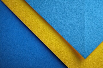 Bright blue and yellow paper layers create a modern, artistic design with textured surface and vibrant colors in a clean composition