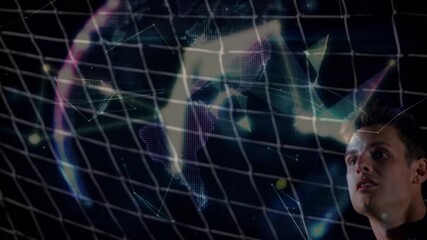 Keeper watching digital particles forming globe over net, leaping catching ball in sports analysis - Powered by Adobe