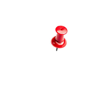 A single red pushpin against a black background.  Close-up view of the pinhead and point