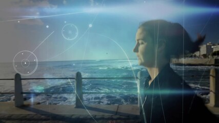 Runner starting seaside jog, showing wrist tracker and circular HUD tracking performance metrics - Powered by Adobe