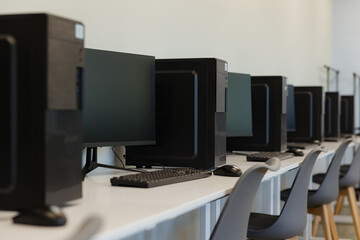 Workstations lined up in a modern office space promoting productivity and collaboration